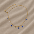 Goldkette mit birnenförmigem Saphir