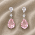 Glänzende rosa Tropfenohrringe